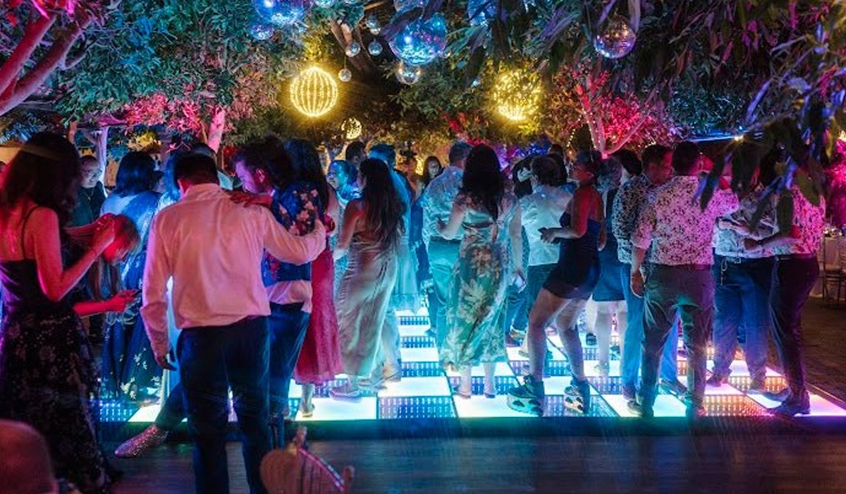 Event venue with LED dance floor creating a bright immersive experience
