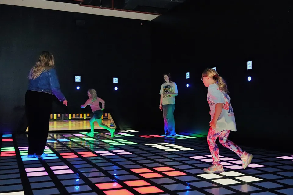 Interactive floor games system combining LED interactive floor and motion-based interactive wall for indoor entertainment venues
