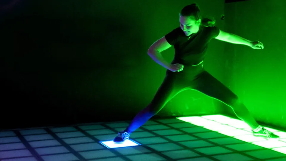 Top-down view showing how foot movements trigger game events on the Vitcor Interactive Game Floor