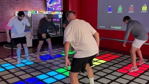 Players jumping and stepping on the Vitcor Interactive Game Floor for immersive multiplayer challenges
