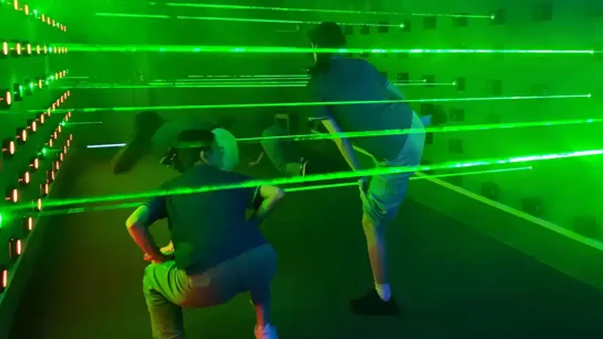 Group challenges and team building in a laser maze room