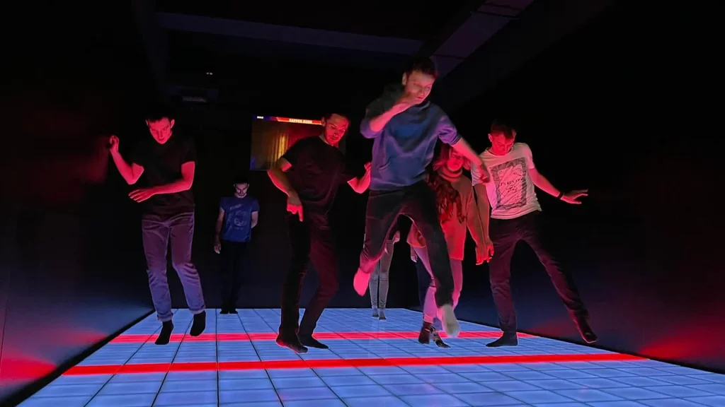 Exploring how does activate games work with a high-tech interactive LED floor system installed in a busy indoor entertainment center.