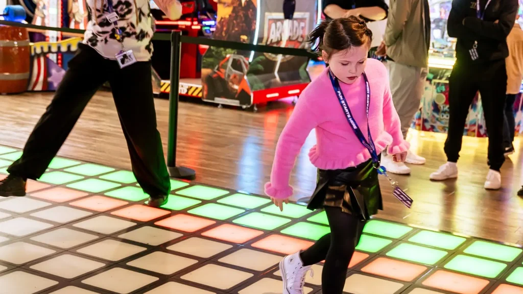 Interactive Game Floor cost structure and system diagram showing LED grid gameplay mechanics, player tracking technology, and how the system supports a high ROI commercial entertainment model