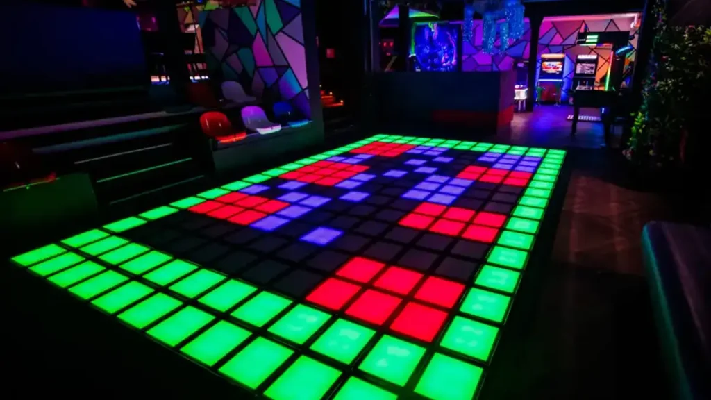 interactive active gaming room with LED floor tiles and multiplayer gameplay