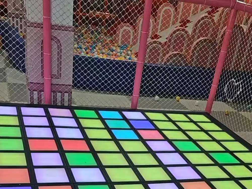 A professional interactive game floor manufacturer supplying glowing jumping grid tiles for high tech activate games rooms