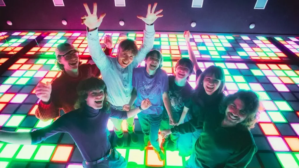 Best Interactive Attractions for FEC Venues (2026 Guide) 2 Players on colorful LED interactive floor showing why active gaming FEC attractions outperform traditional arcade machines for group play and replay value
