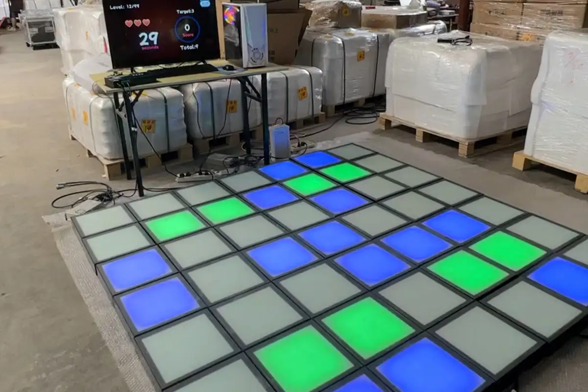 Interactive game floor factory testing Technician testing interactive game floor modules and games before shipment