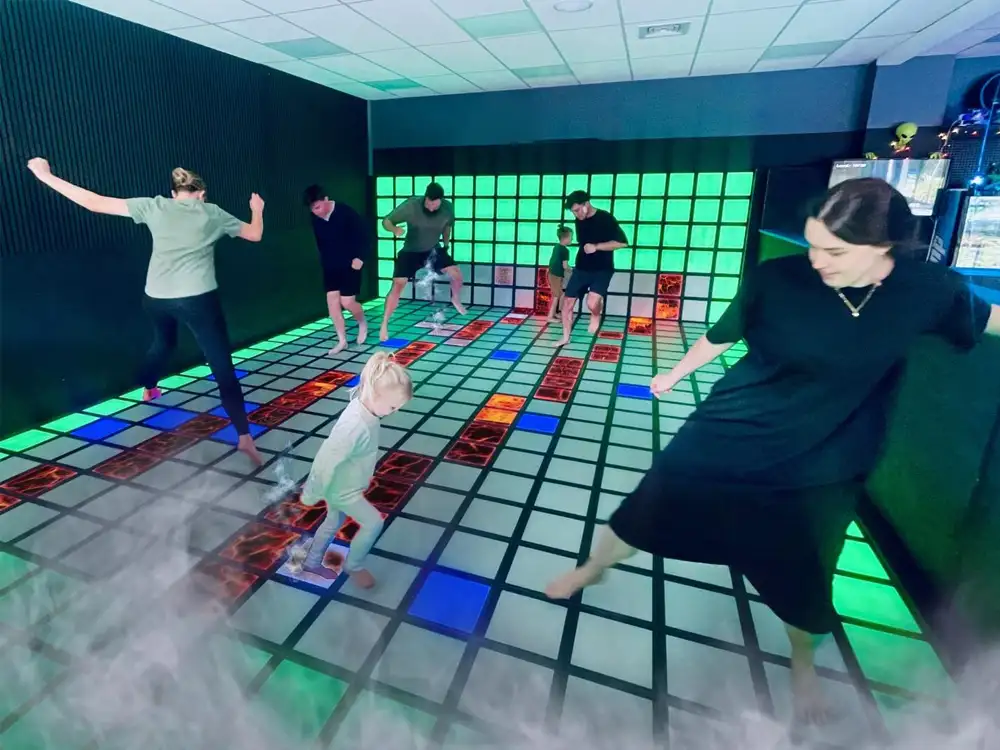 Custom interactive game floor manufacturer providing heavy duty LED grid tiles for family entertainment centers