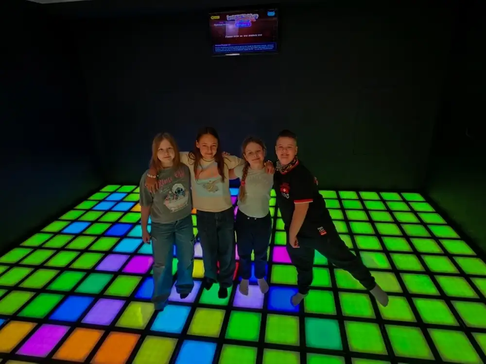 Interactive LED floor light gaming installation for luxury hotel kids clubs and resort entertainment zones designed by manufacturer