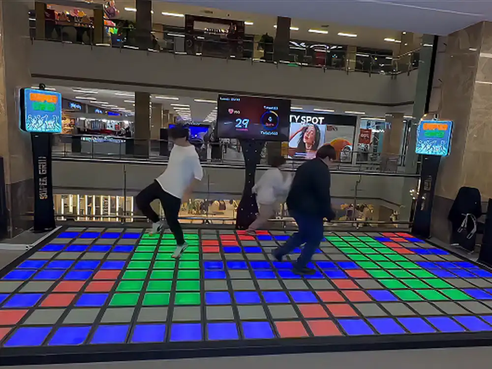 High traffic shopping mall attraction using smart interactive floor tiles from an expert interactive game floor manufacturer