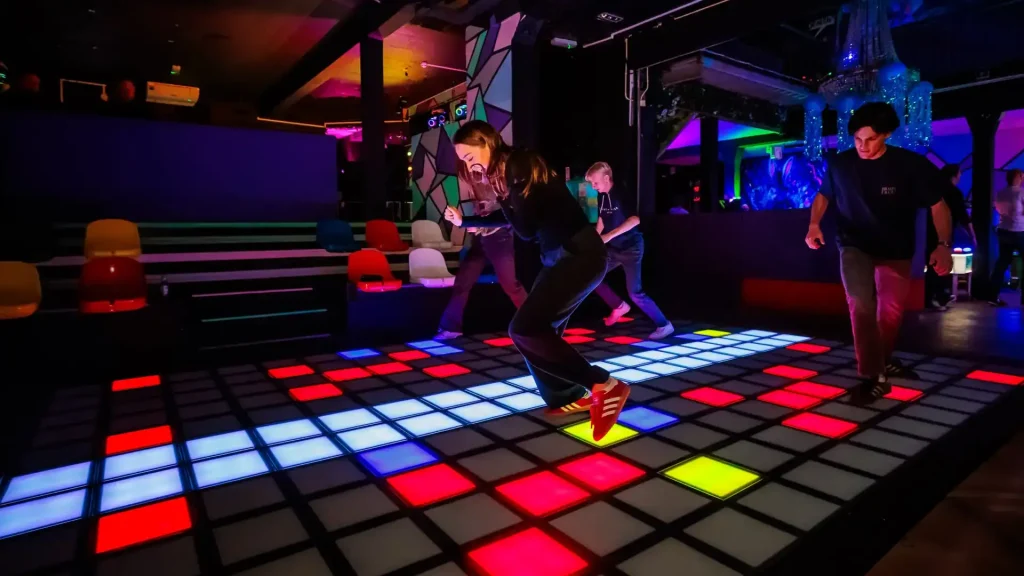What Is Activate Games? The Business Model FEC Operators Need to Understand (2026) 2 RFID wristband check-in and timed session format inside an Activate Games style commercial active gaming venue