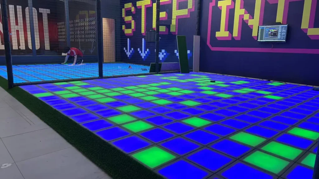 What Is Activate Games? The Business Model FEC Operators Need to Understand (2026) 3 Multiple challenge room types including interactive game floor laser maze and push button wall inside an active gaming venue