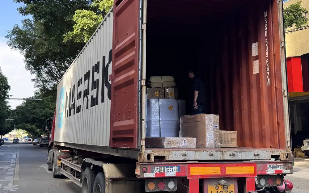 Factory container loading process for shipping interactive game room systems worldwide