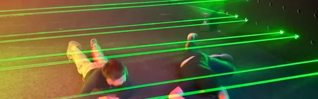 Commercial laser maze game attraction for family entertainment centers