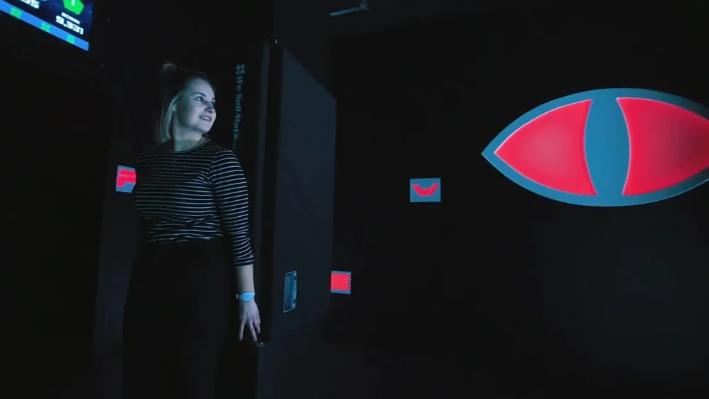 Evil Eyes Hide Game: Why Stealth Rooms Work in Active Gaming Venues (2026) 1 Players navigating an evil eyes hide game inside a commercial active gaming room for FECs