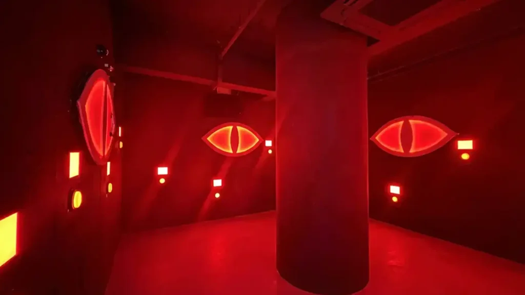 Evil Eyes Hide Game: Why Stealth Rooms Work in Active Gaming Venues (2026) 4 Glowing evil eyes motion sensors scanning the room during a commercial evil eyes hide game challenge