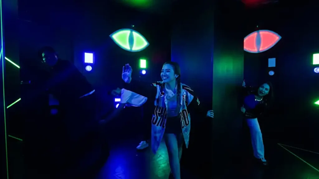 Evil Eyes Hide Game: Why Stealth Rooms Work in Active Gaming Venues (2026) 3 Team coordinating roles during a multiplayer evil eyes hide game session in a commercial venue