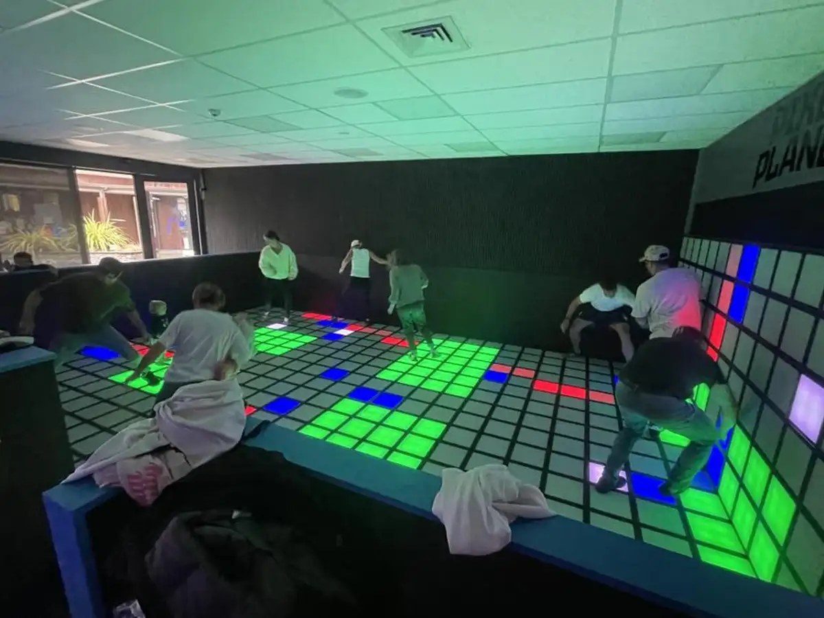 Commercial interactive game floor room size reference — from 100-tile starter setup to 500-tile Mega Grid flagship configuration for FECs and arcades