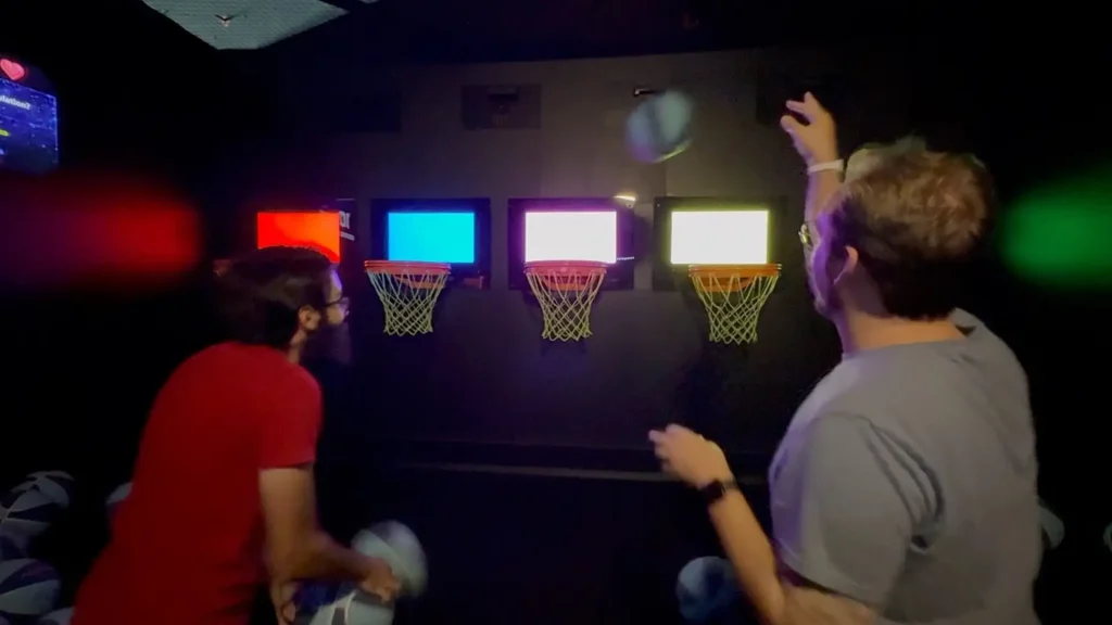 Interactive Hoops Game: Why Basketball Challenge Rooms Work in Active Gaming Venues (2026) 2 LED color-shifting backboards and real-time scoring display inside a commercial interactive hoops game room
