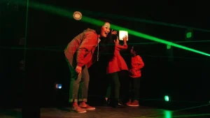 Comparison between commercial laser maze game and interactive game floor attractions for FECs