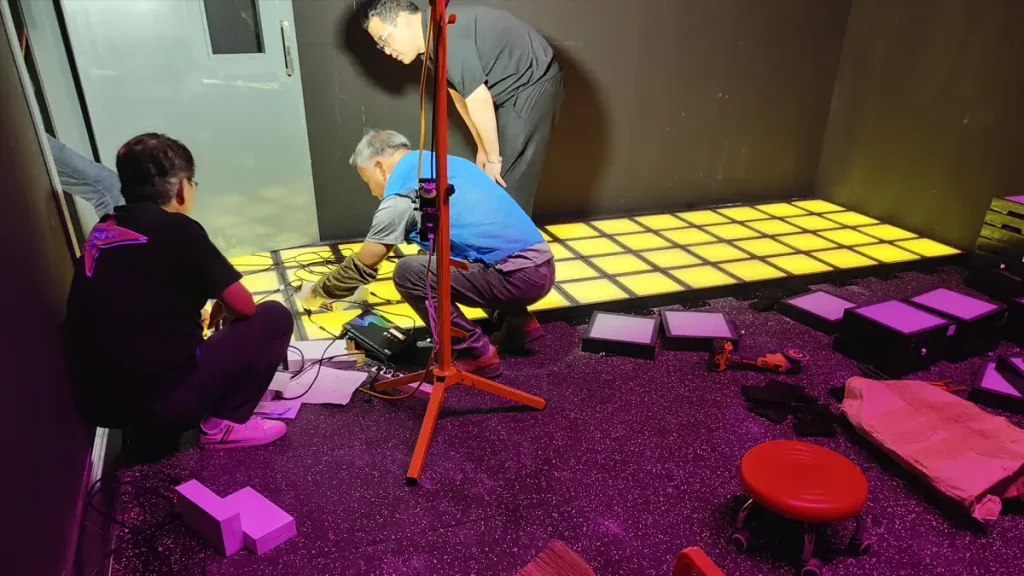 Commercial active gaming room equipment showing certified LED tiles and dynamic load rated sensors for FEC operators