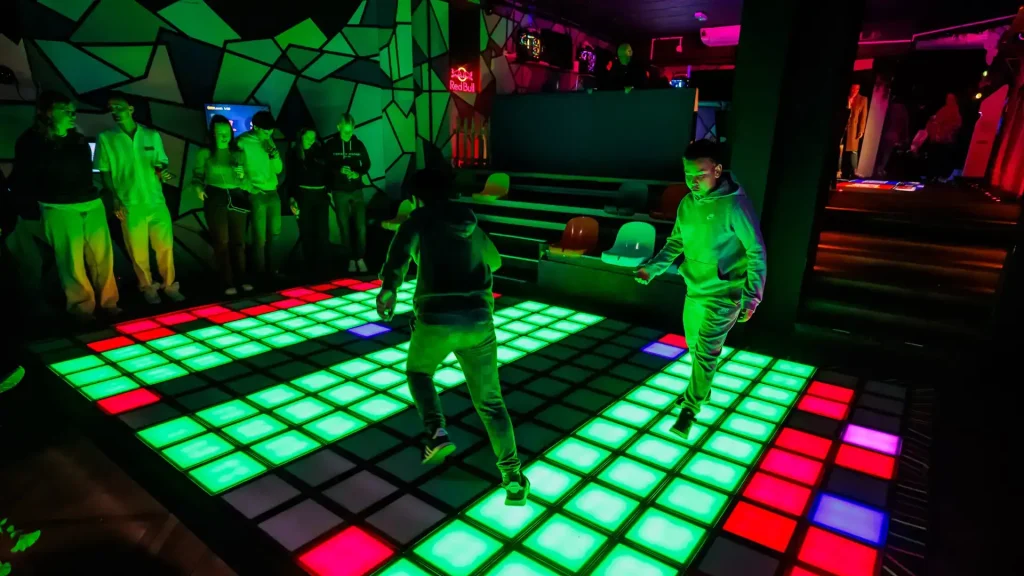 Pixel Floor Game vs Arcade vs VR: Which One Should You Invest In? 3 pixel floor game group interaction versus isolated VR headset gameplay