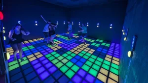 Blog 2 Students playing on an interactive game floor for schools during a recess or break period
