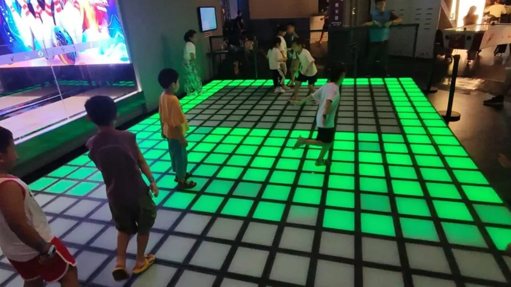Interactive Game Floor for Shopping Malls: Layout, Foot Traffic & Business Case (2026) 2 Interactive game floor for shopping malls shown in a brand activation setup used to drive foot traffic