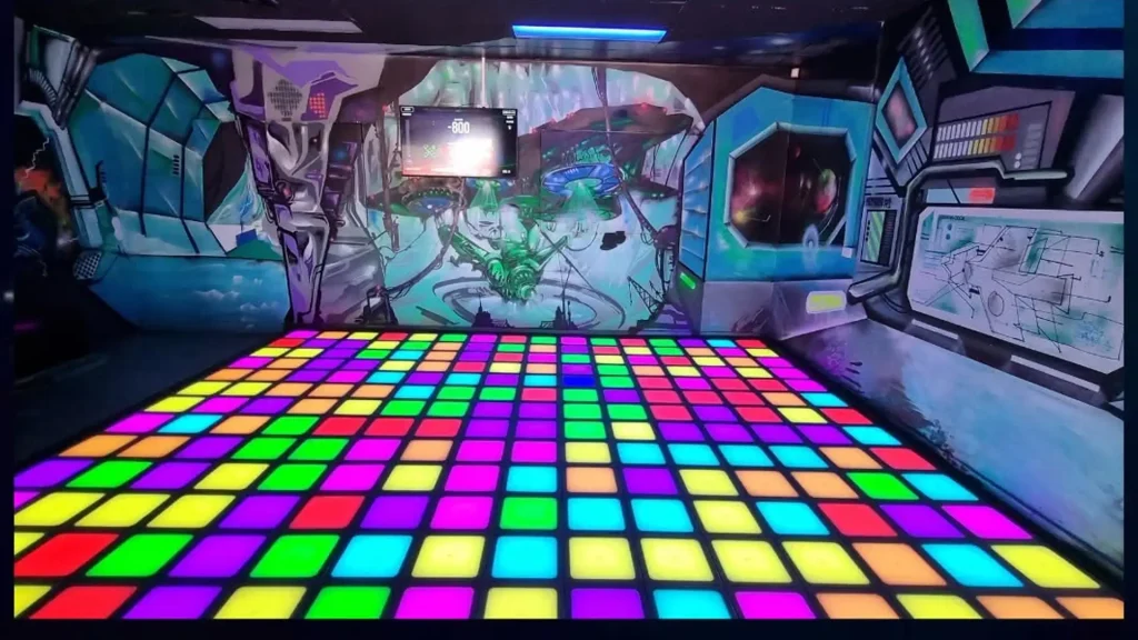Interactive Game Floor for Hotels and Resorts: Guest Experience Guide (2026) 2 Family playing on an interactive LED game floor, showing real gameplay and player interaction