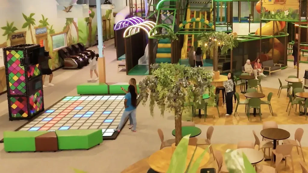 Interactive Game Floor for Trampoline Parks: Layout, ROI & Installation Guide (2026) 2 Interactive game floor positioned near a trampoline park entrance and party room area
