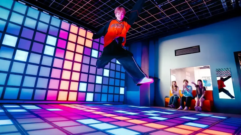 Interactive Game Floor for Gyms and Fitness Centers: The Active Entertainment Opportunity (2026) 2 Youth athletes using an interactive game floor for reaction and agility training