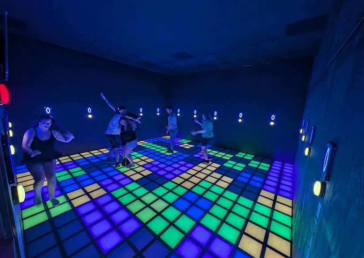 Multiplayer pixel floor game with LED grid tiles in commercial venue