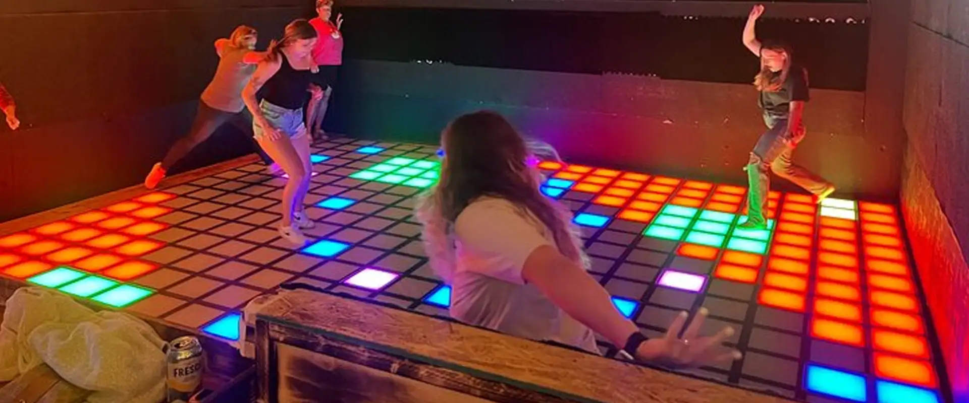 Interactive Game Floor Dimensions & Space Requirements 1 nteractive game floor dimensions: players on a green floor built from 30 x 30 cm tiles