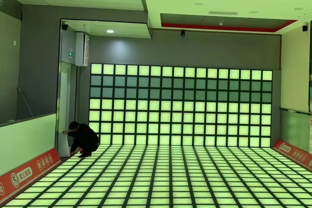 How Interactive Game Floors Work: LED Tiles, Sensors & the Controller 3 LED game floor and matching wall panels running on one controller in an active game room